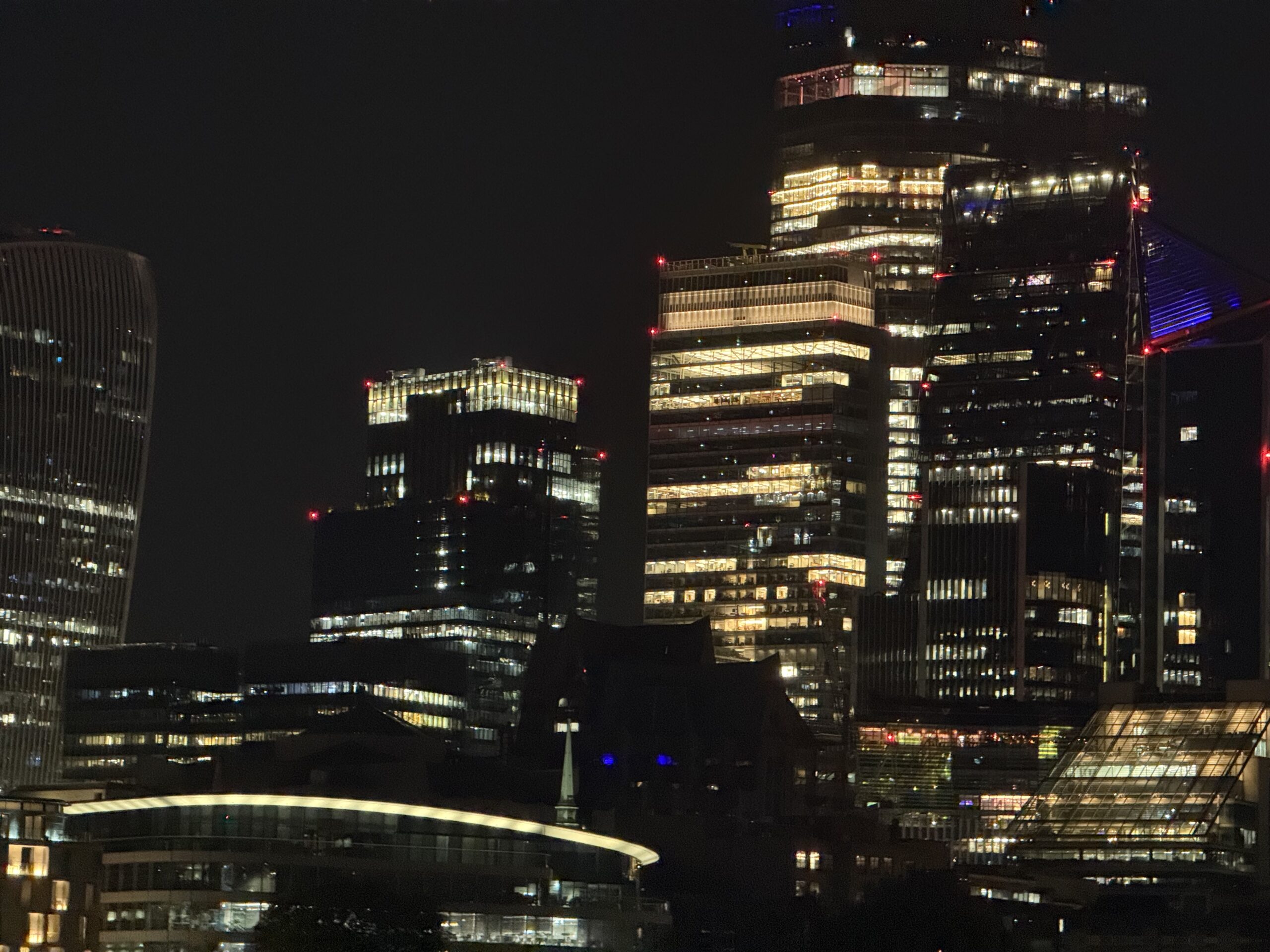 City of London skyline at night near Tower Hill — corporate offices served by iRepairMan