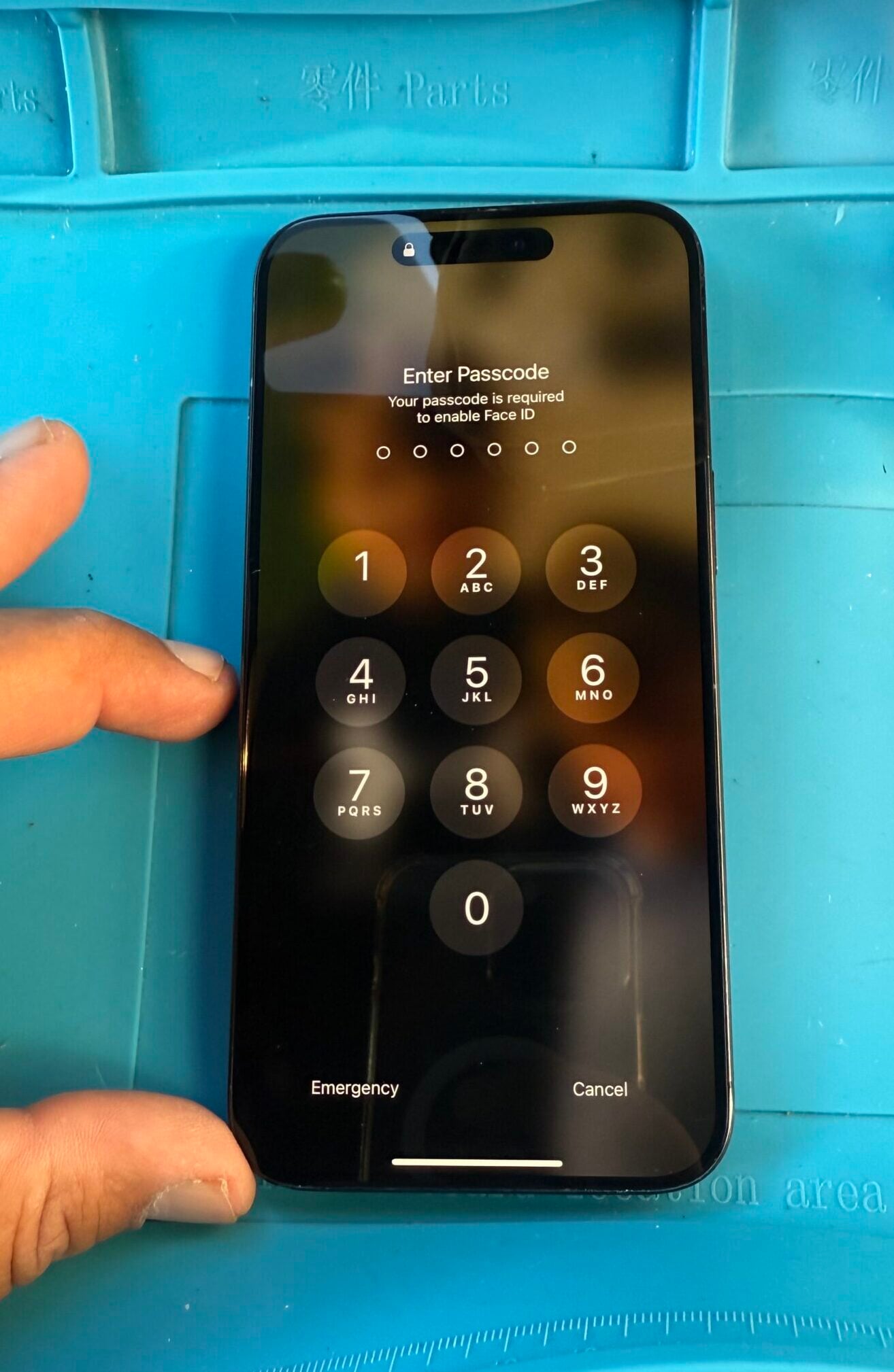 After Repair – iPhone 15 Pro Max (AL2) After: iPhone 15 Pro Max restored with genuine Apple screen showing passcode in Bricket Wood AL2