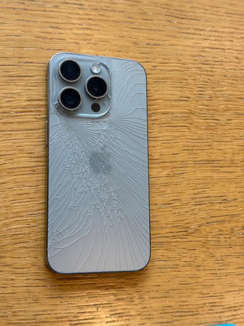 Shattered iPhone 15 Pro back glass before repair in Central London