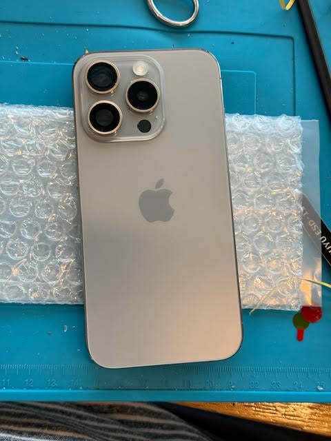 iPhone 15 Pro back glass replaced after on-site repair