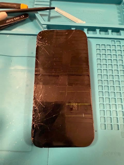 Cracked iPhone 16 Pro with top display unresponsive before repair in Fore Street EC2