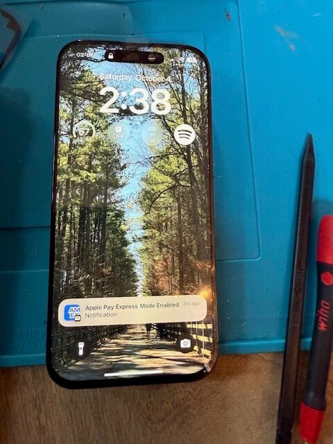 Repaired iPhone 16 Pro showing clear display after screen replacement by iRepairMan at Ember Locke Hotel