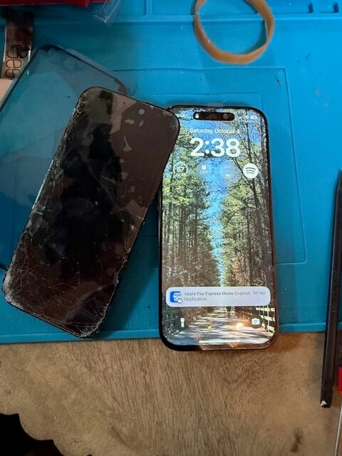 Side-by-side comparison of broken and repaired iPhone 16 Pro screens during hotel lobby service