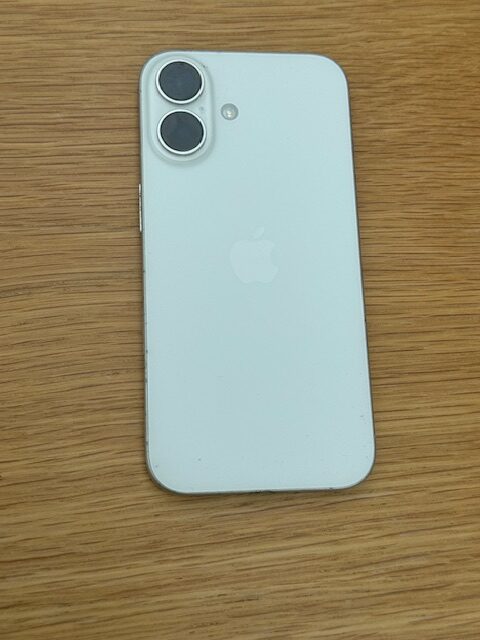 On-site iPhone 16 screen replacement on ESD workstation at customer’s dining table