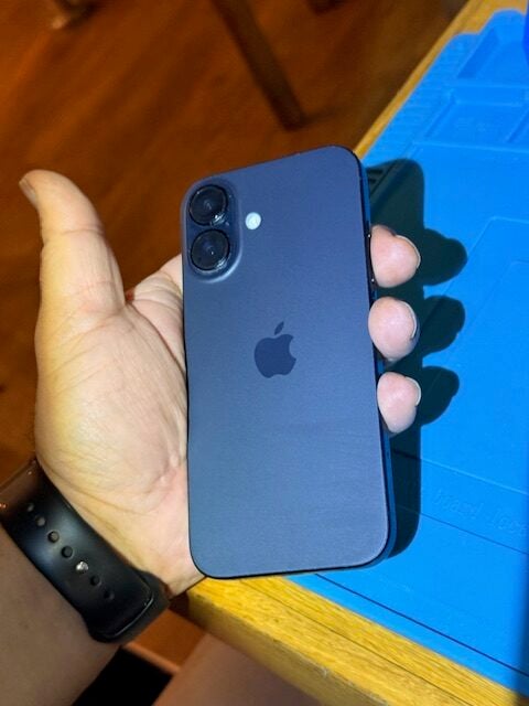 Back of restored iPhone 16 after screen replacement at Heathrow Airport