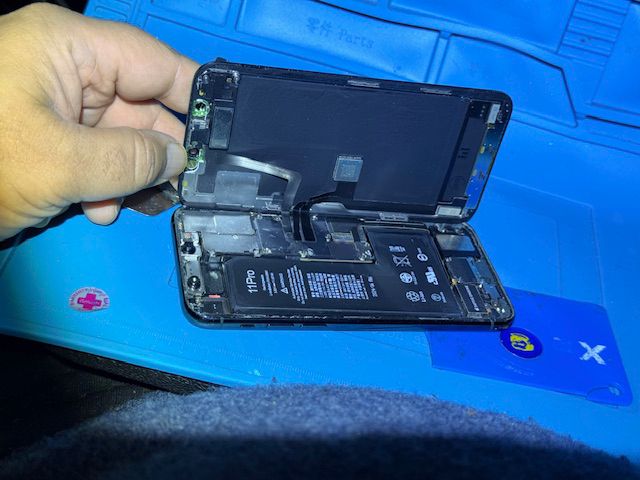 Internal components exposed during iPhone repair