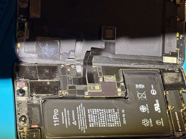 iPhone internal components with battery and logic board