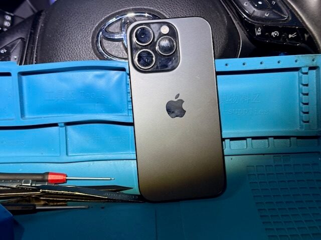 Step 2 iPhone 16 Pro prepared for controlled disassembly during mobile repair in London