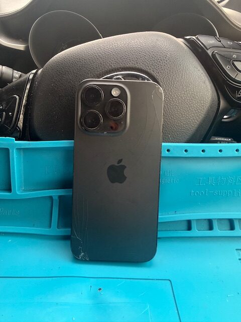 Back side of damaged iPhone 15 Pro before mobile screen repair service in Paddington Green W2 London