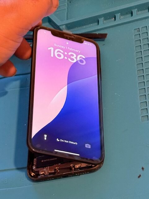 Technician completing iPhone screen repair