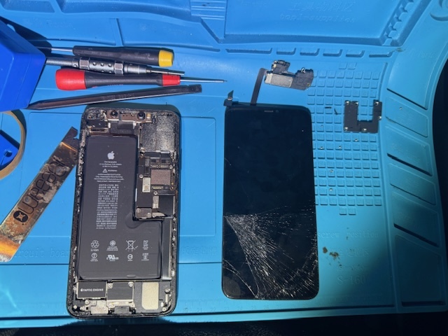 Cracked iPhone screen removed during emergency night repair at hospital