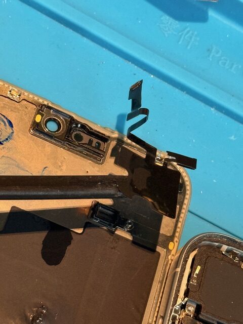 Step 4 iPhone 15 Pro Max repair process in progress with internal components accessed