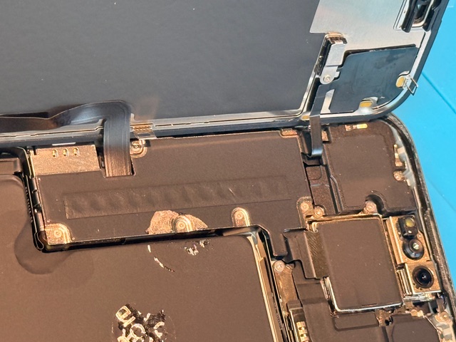 Step 6 iPhone 15 Pro Max screen replacement with internal components checked and aligned
